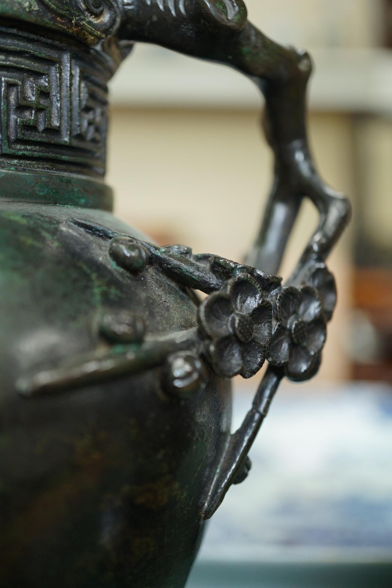 A pair of Chinese bronze gu-shaped vases, Qing dynasty